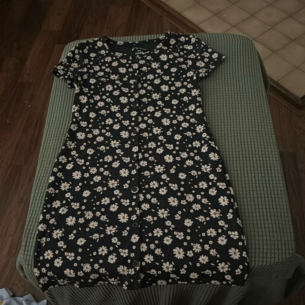 Girls short sleeved button up knee length dress. Black with white flowers.
